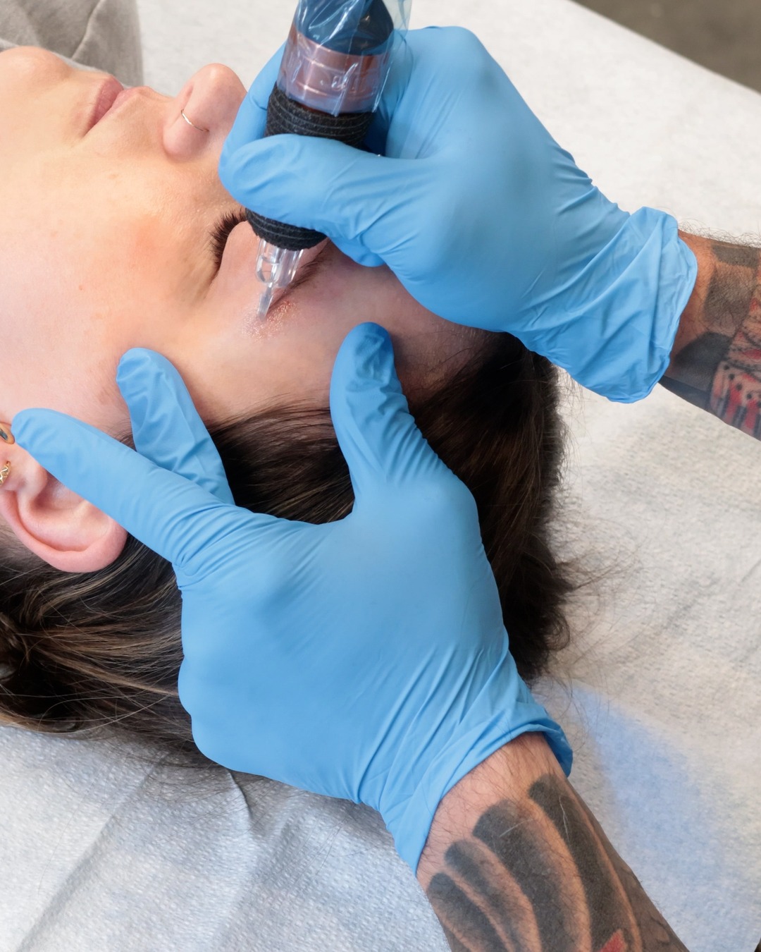 Saline removal on brow pigment, over the shoulder